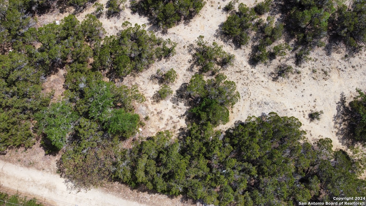 an aerial view of house with yard