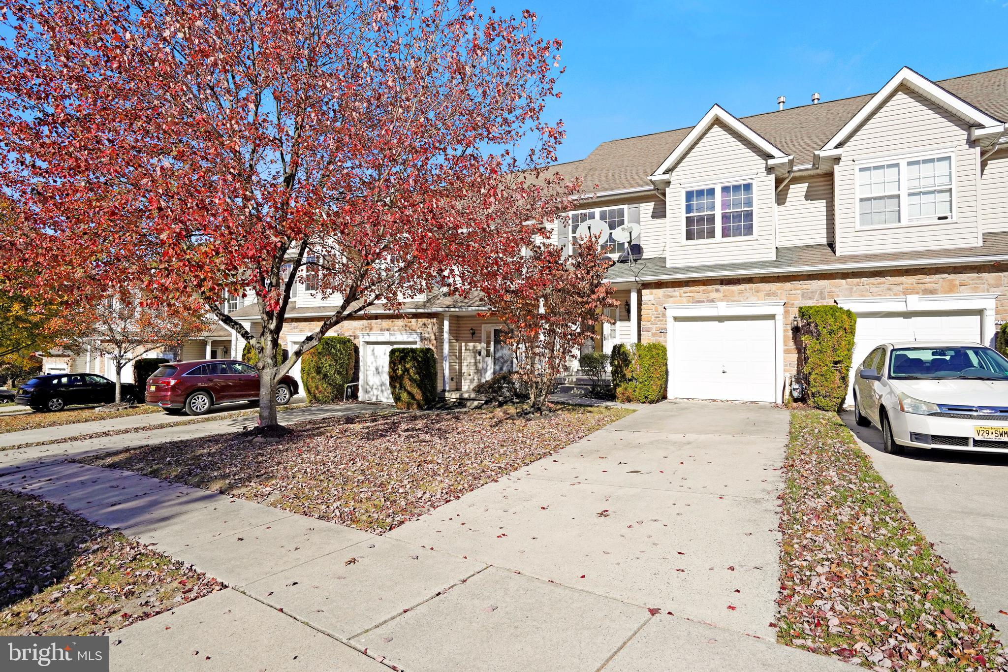 a view of a car park in front of a house