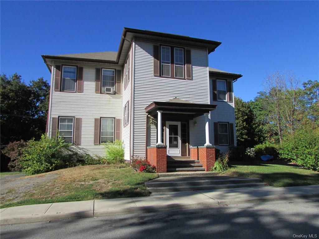 a front view of house with yard