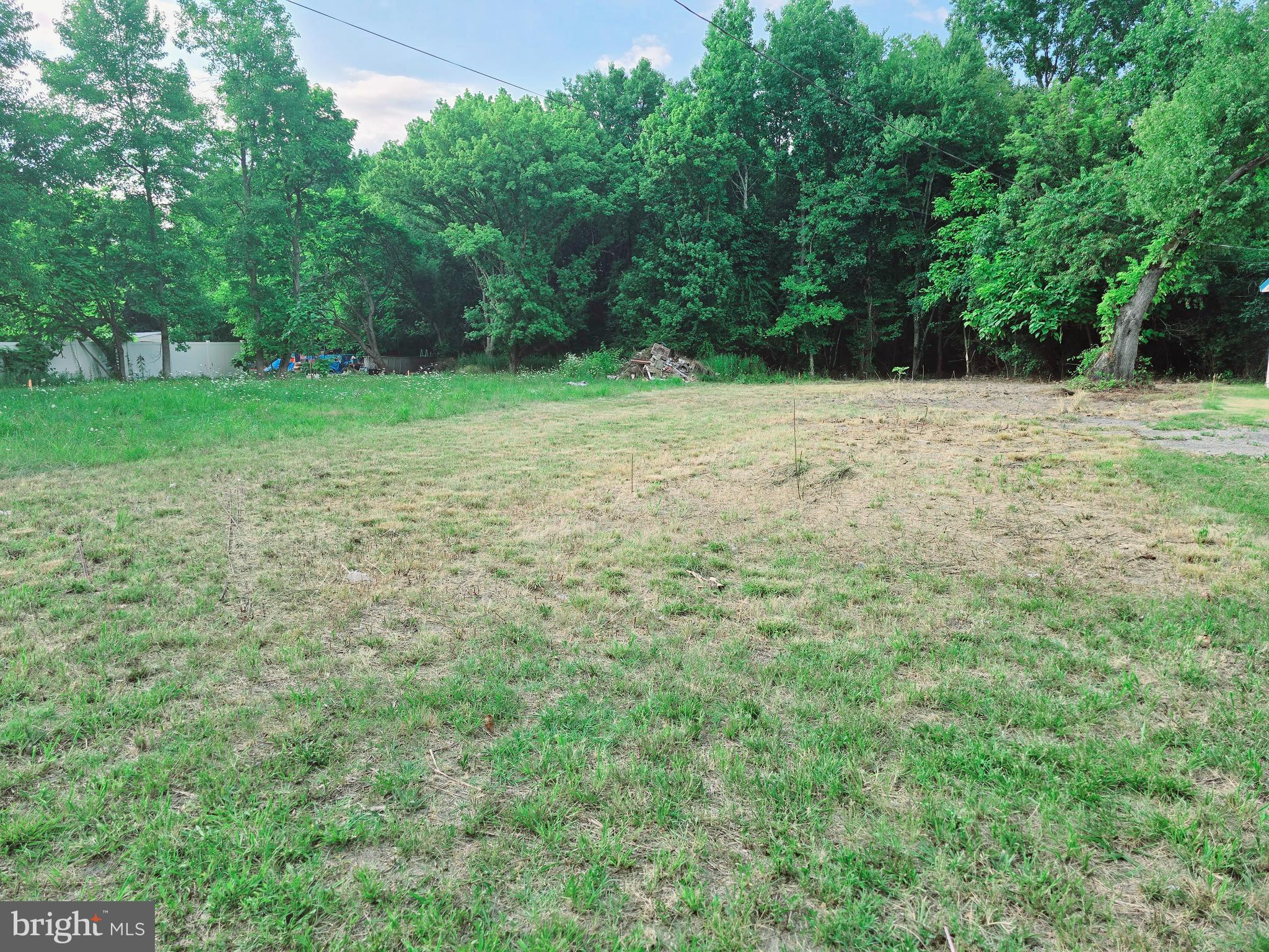 a view of outdoor space with deck and yard