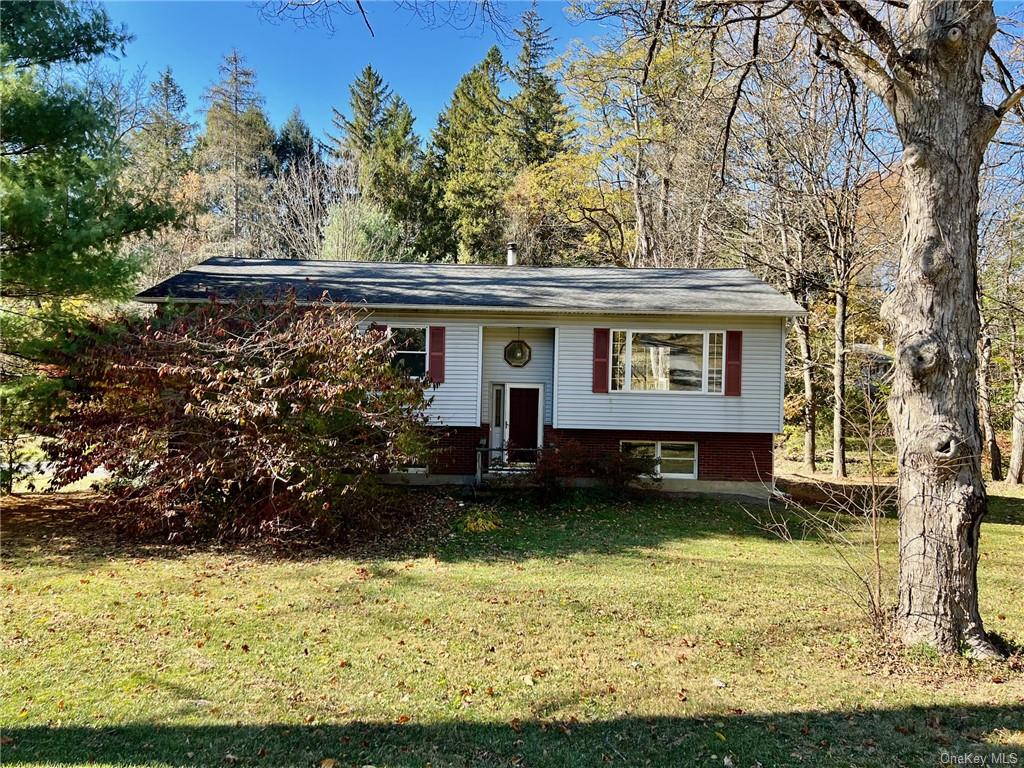 a view of a house with a yard