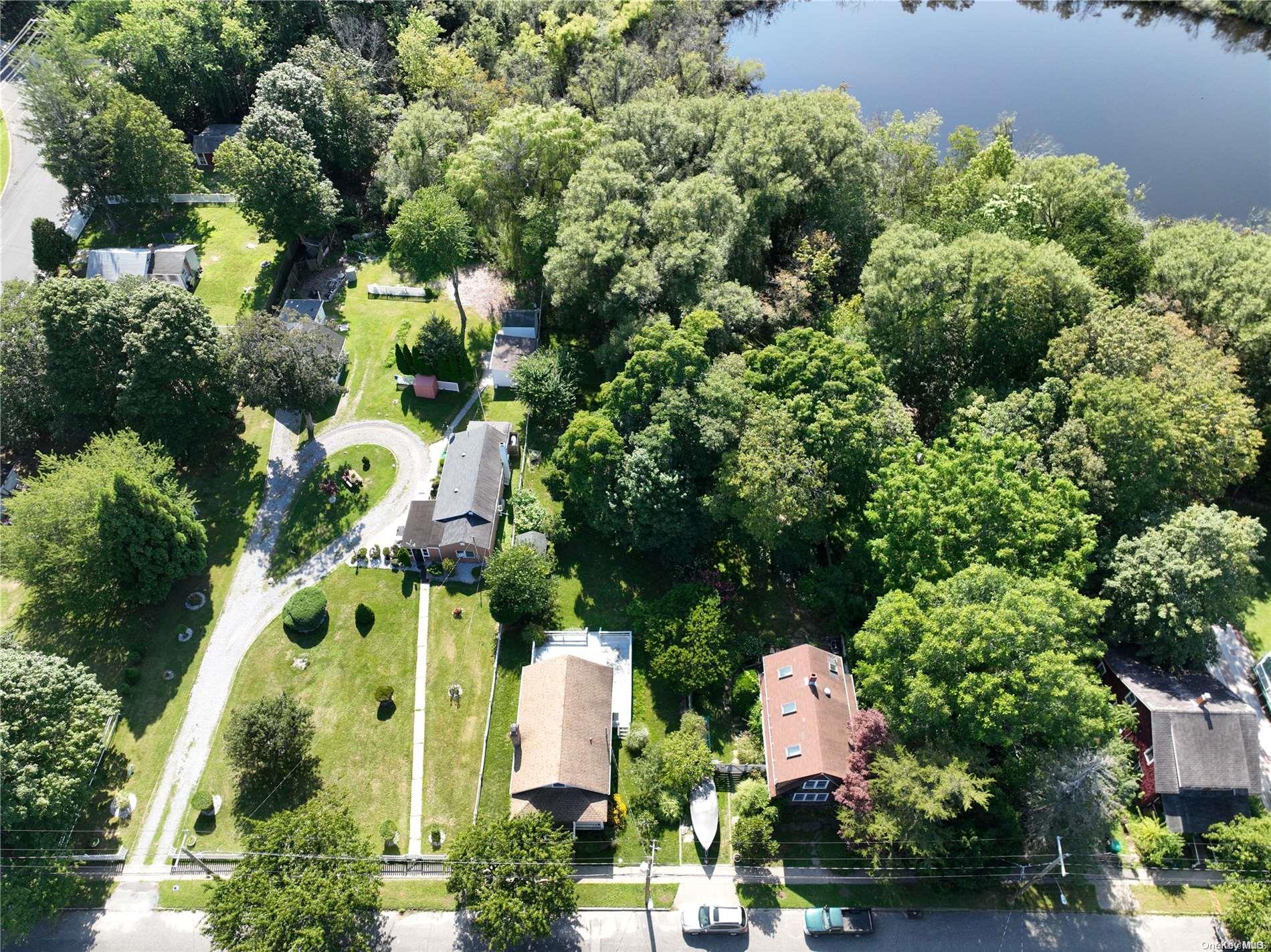 an aerial view of residential house with swimming pool and outdoor space