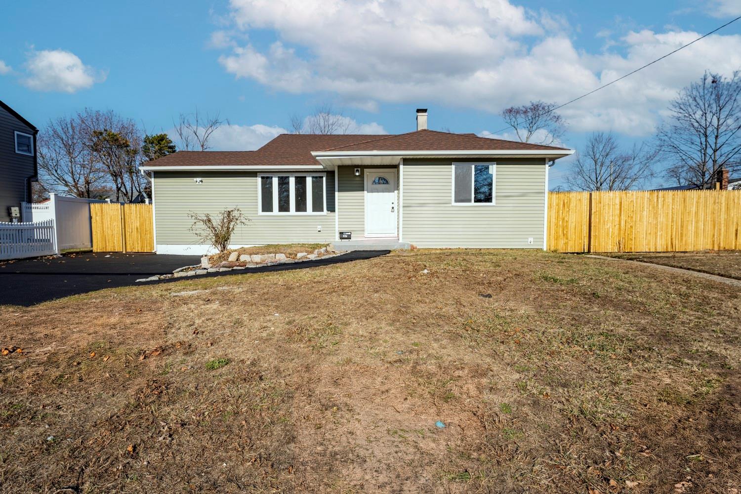 a view of a house with a backyard