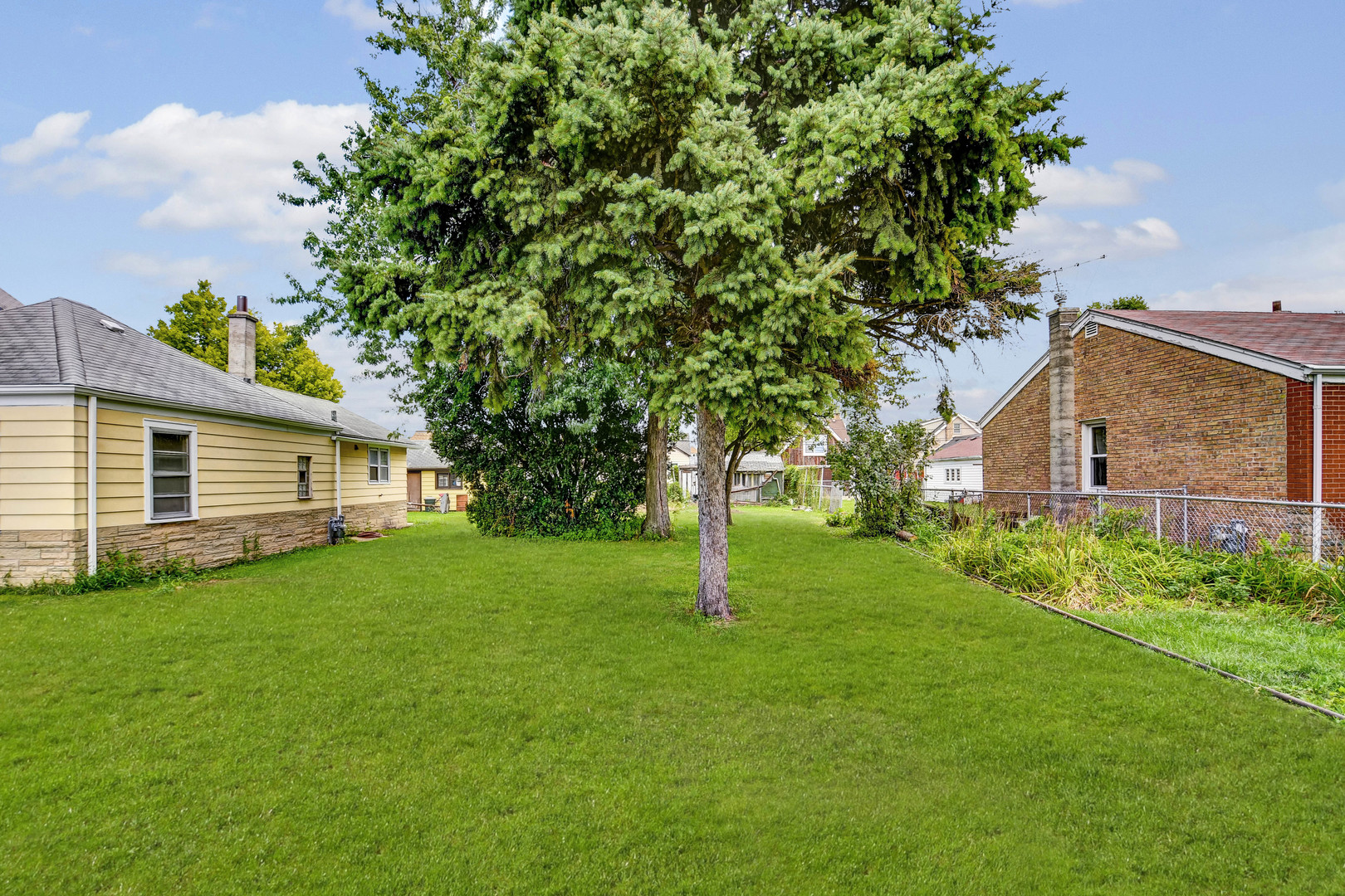 a backyard of a house with lots of green space