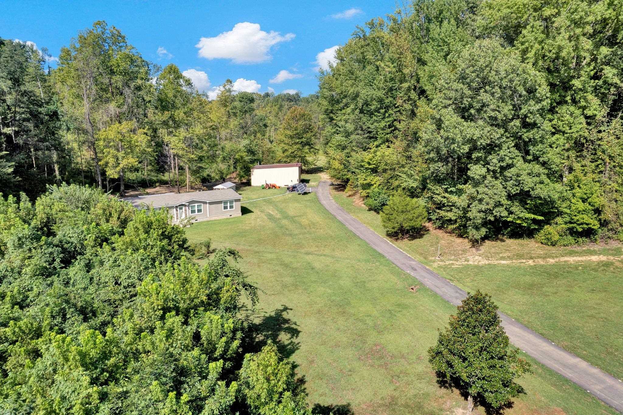 a view of a swimming pool and a yard