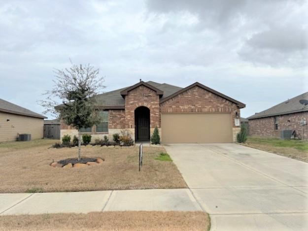 a view of a house with a yard and garage