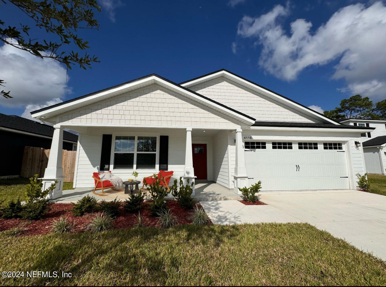 a front view of house with an outdoor seating