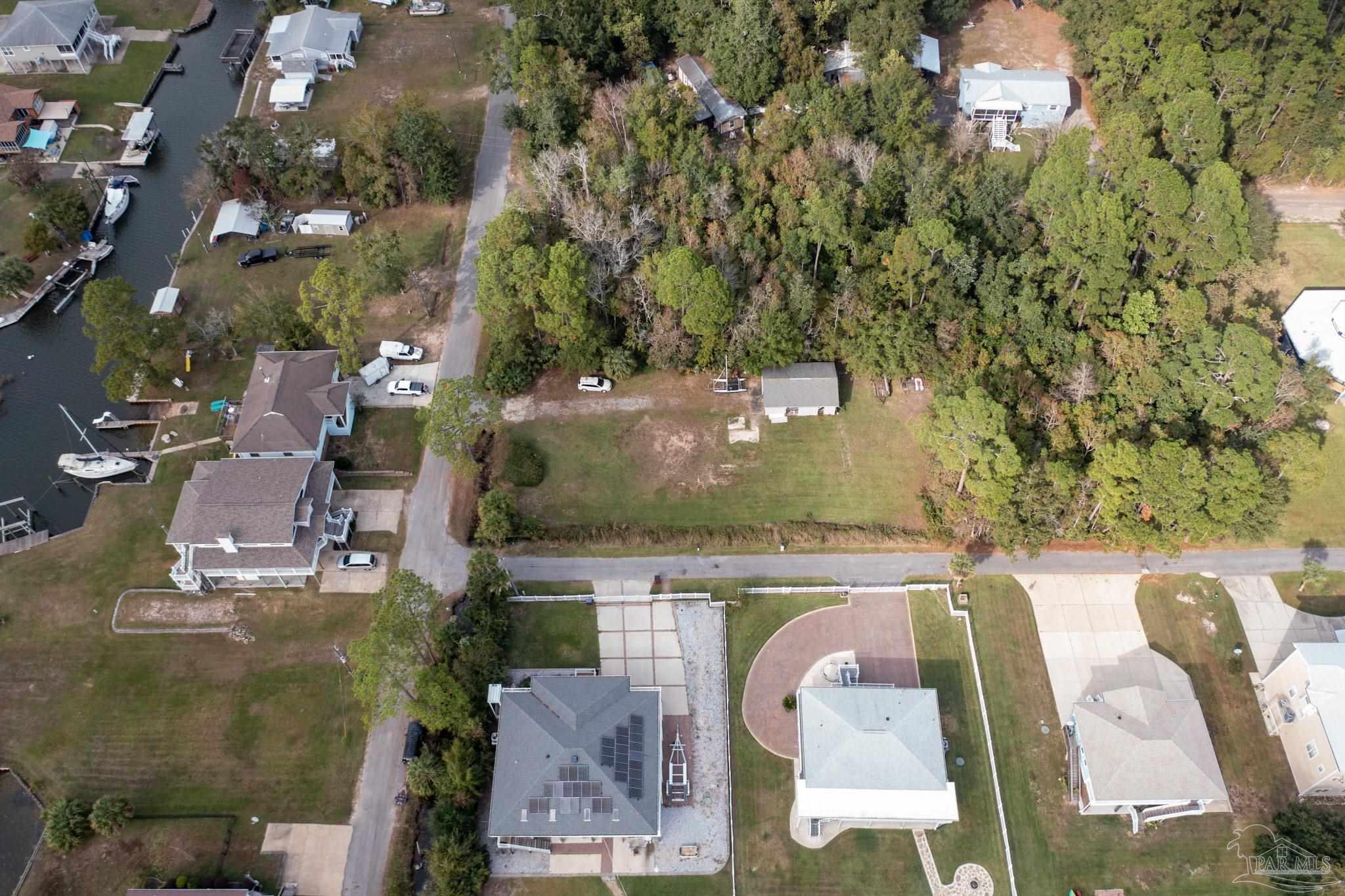 an aerial view of a house with swimming pool