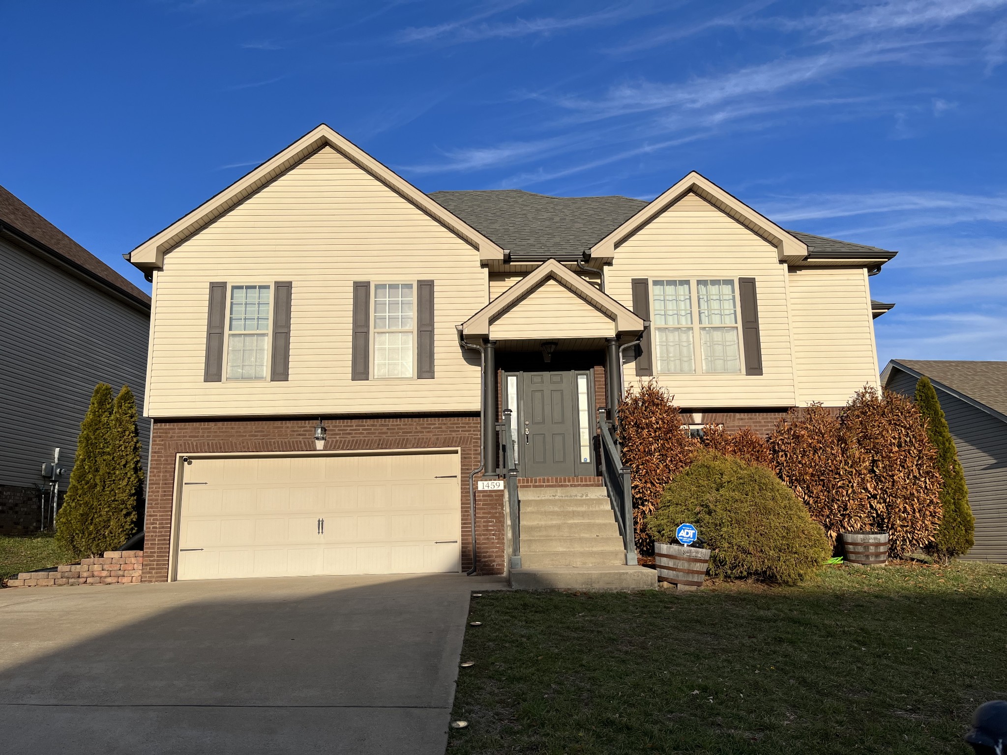 a front view of a house with a yard