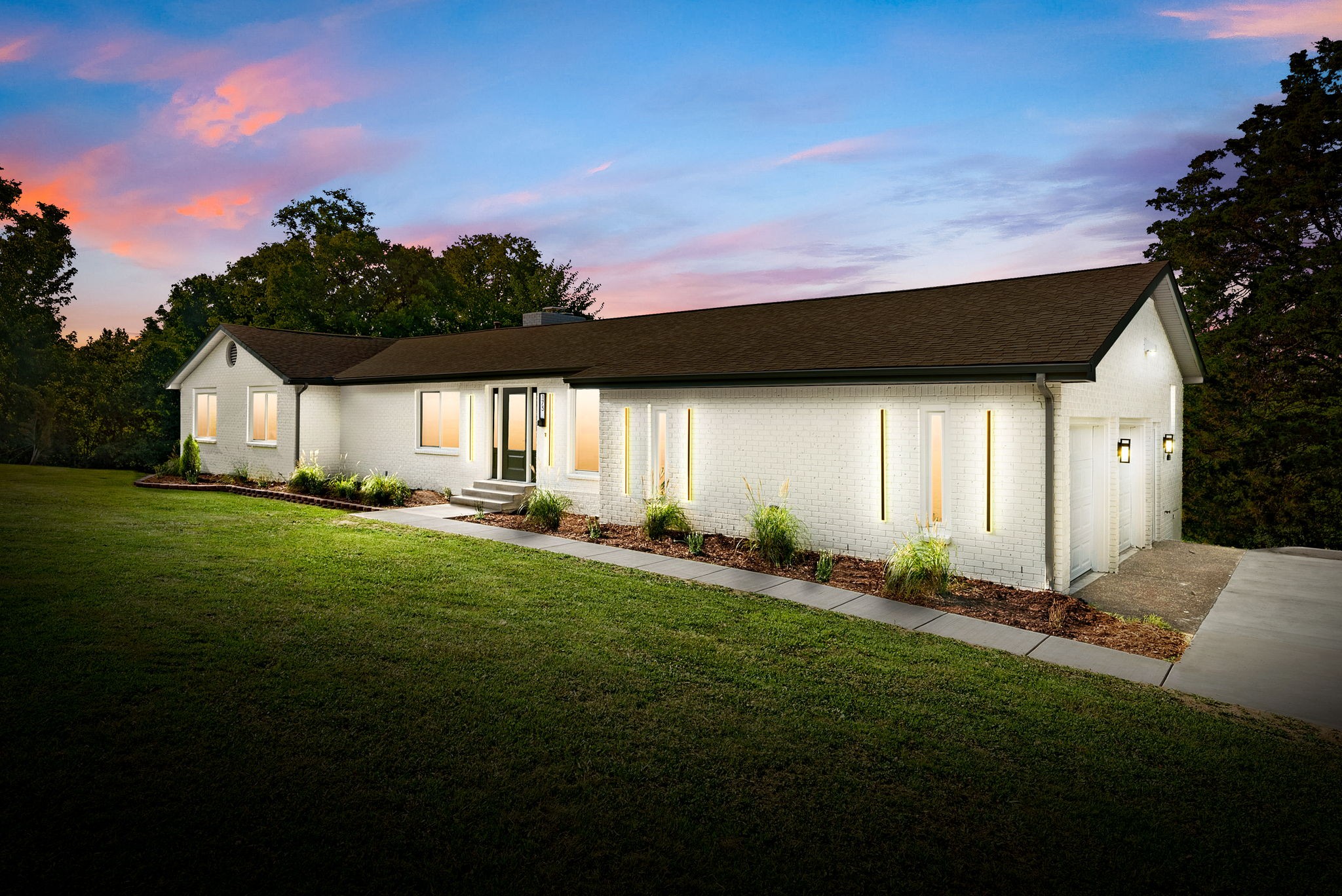 a front view of house with yard and green space