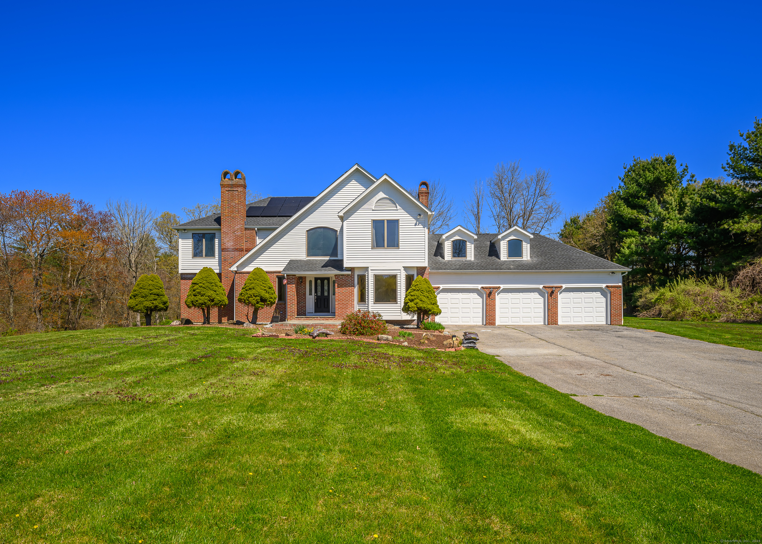 a view of a house with a big yard