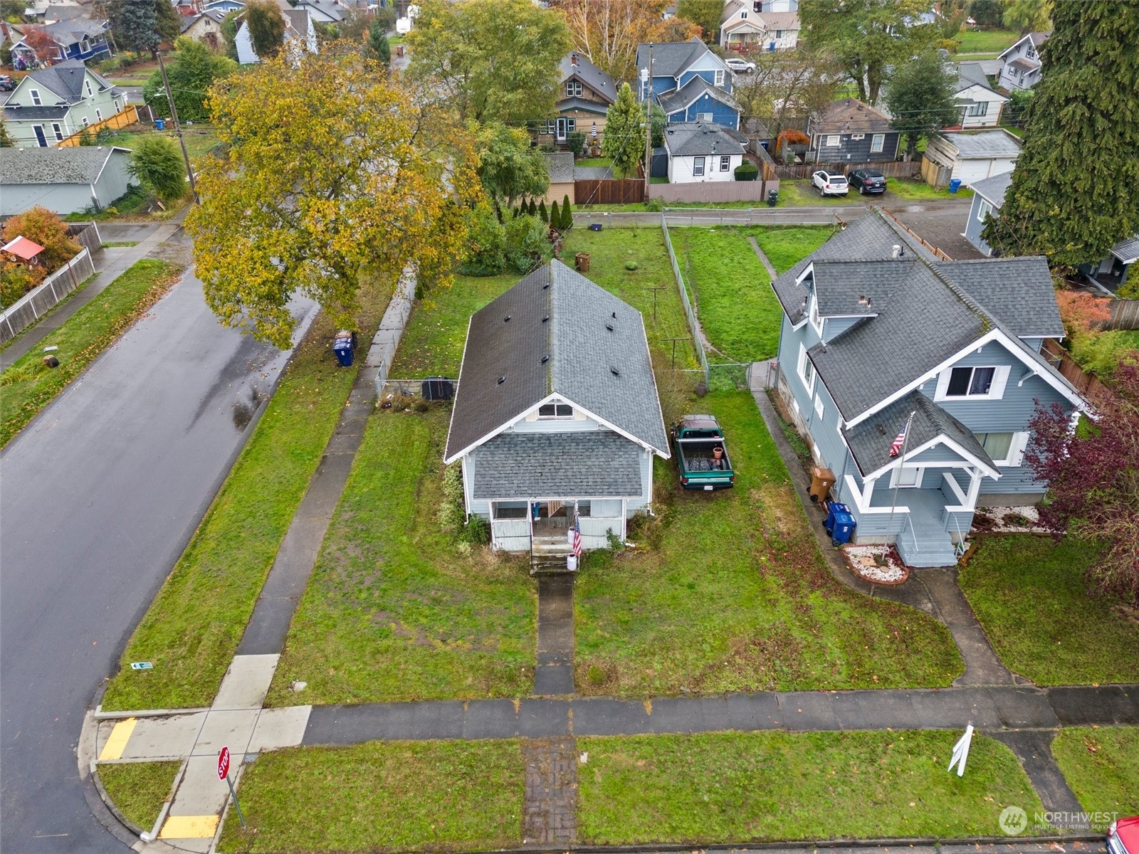 an aerial view of a house with a garden and swimming pool