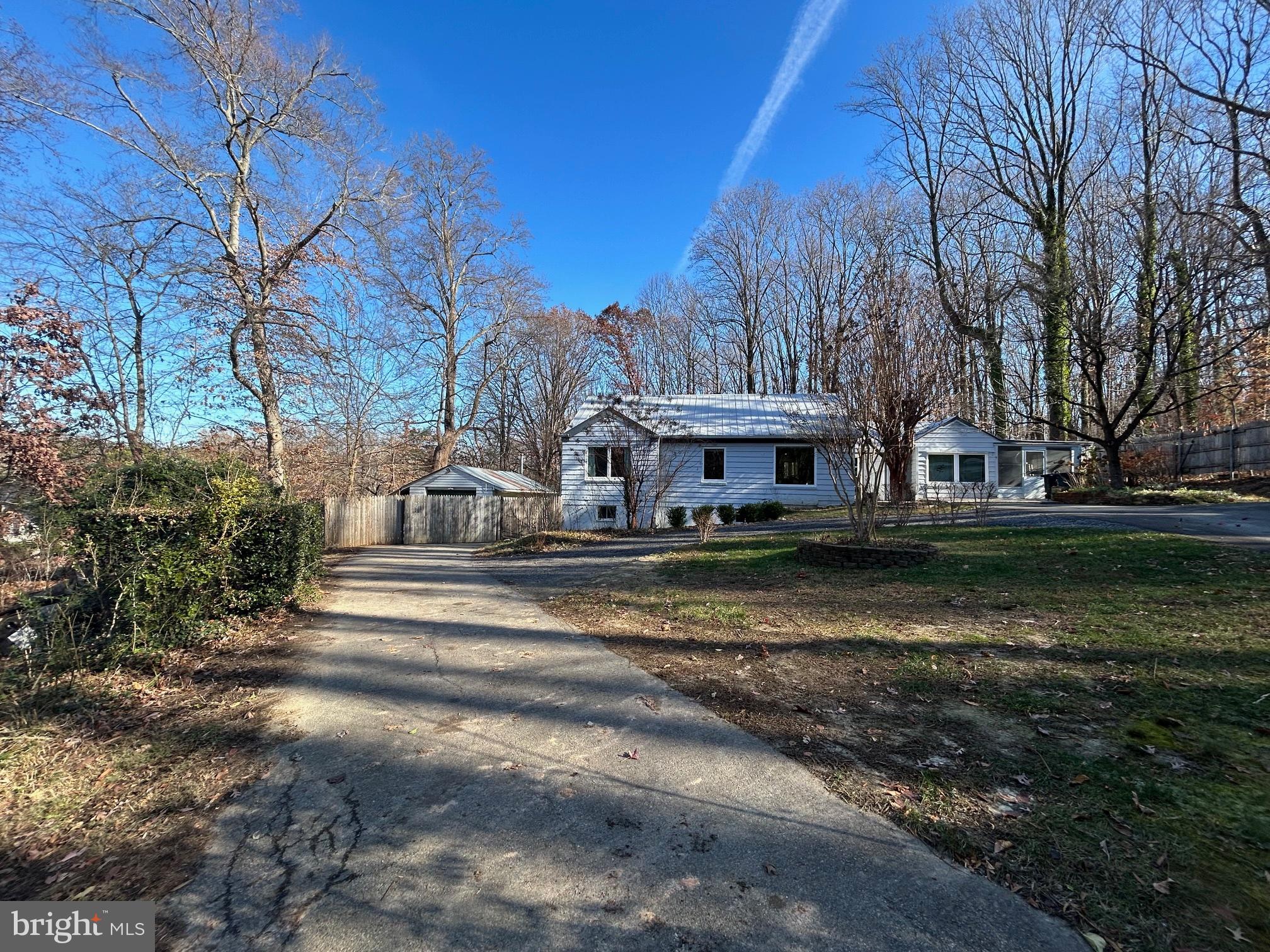 a view of a house with large trees