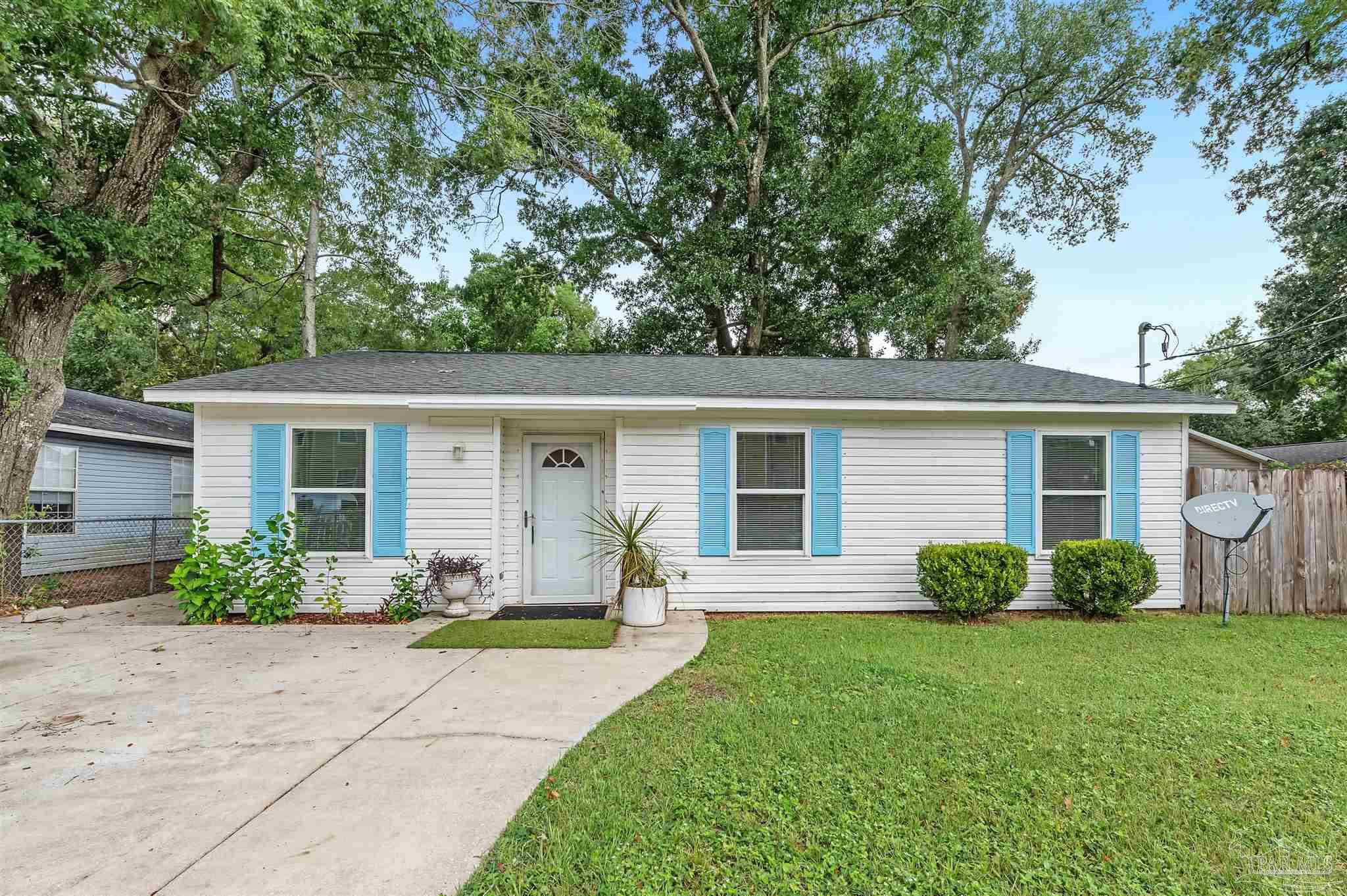 front view of a house with a yard