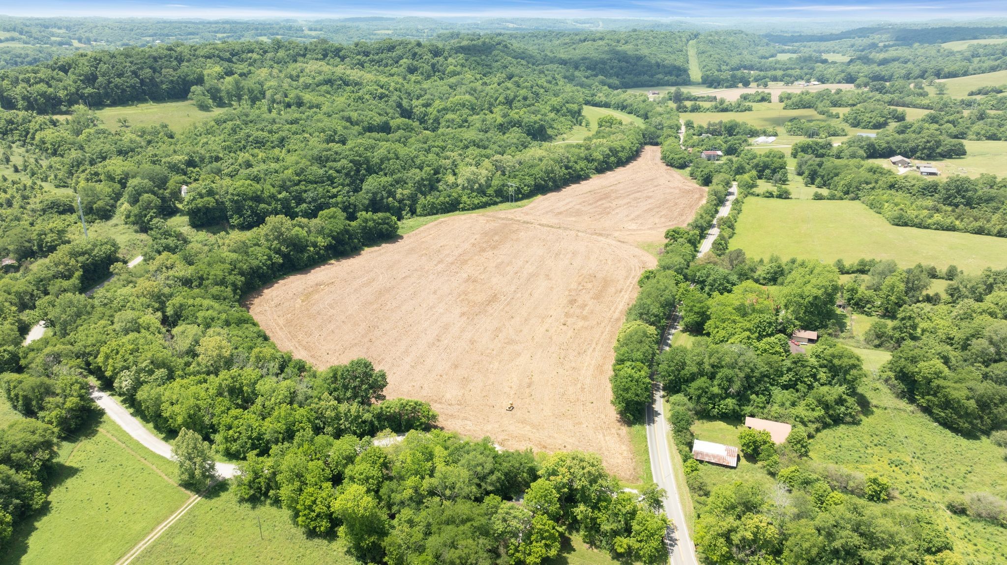 an aerial view of a houses with yard