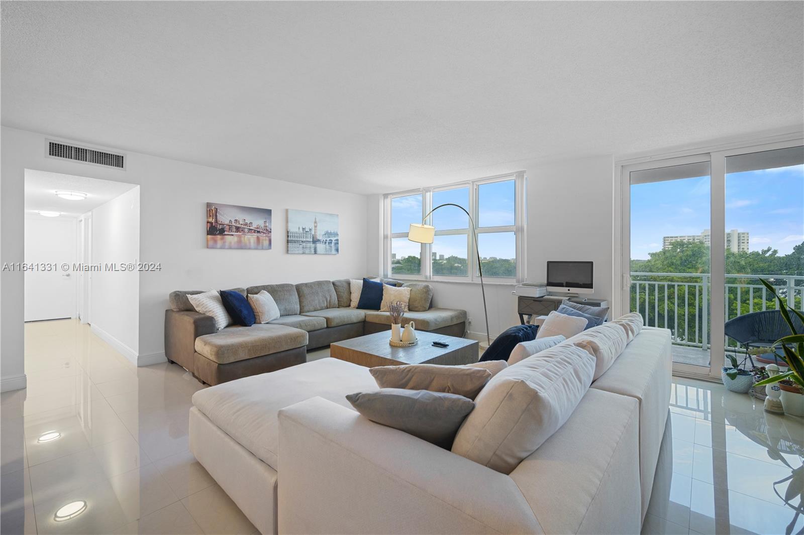 a living room with furniture and a table