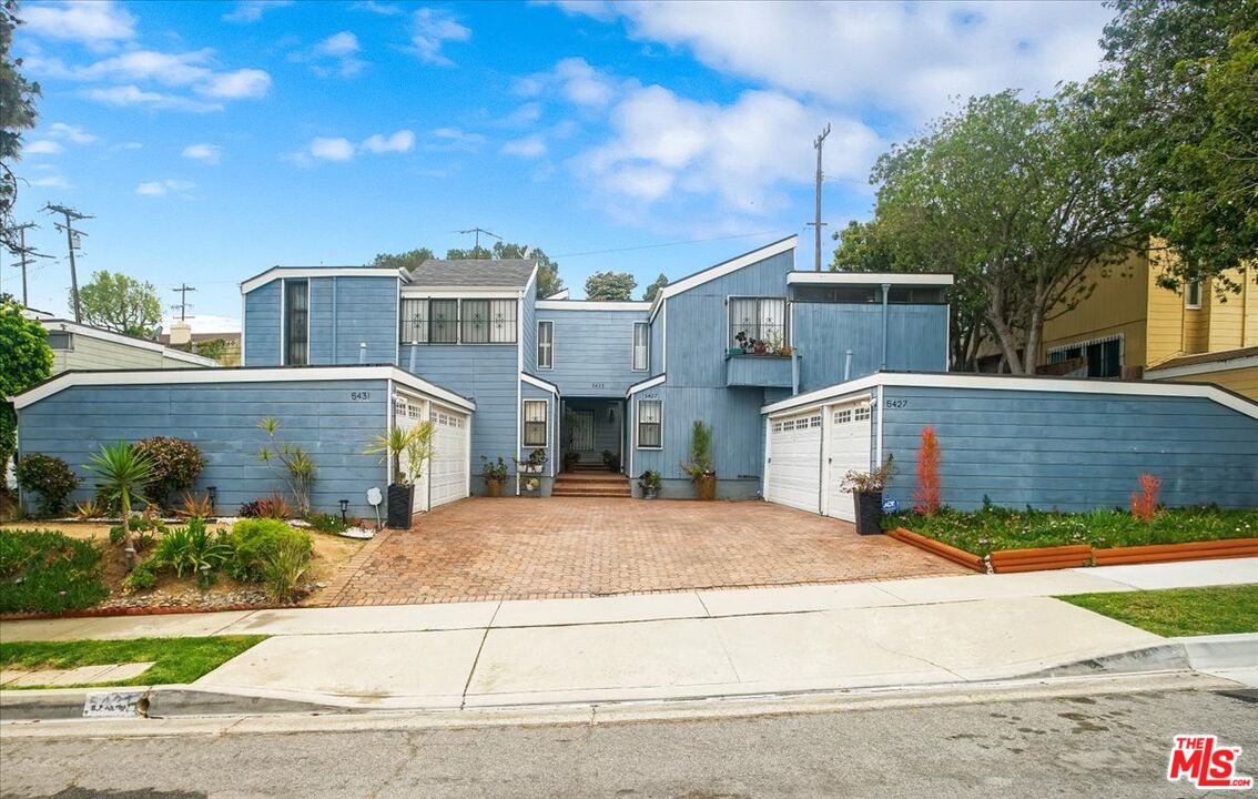 front view of a house with a street