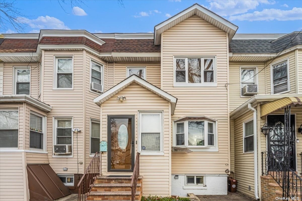 a view of a house with wooden deck