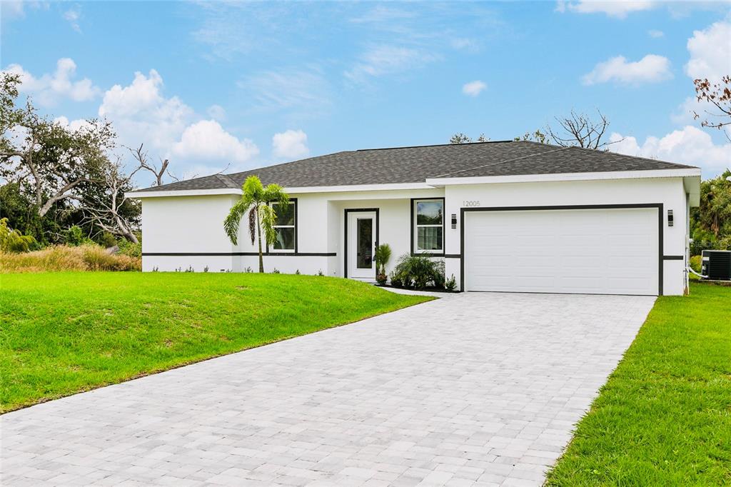 a front view of house with yard and green space