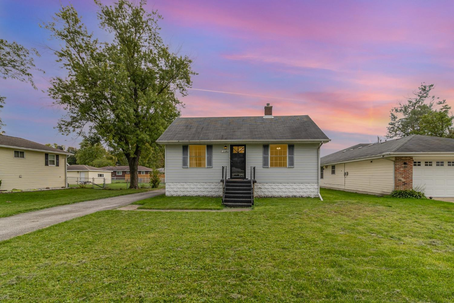 a front view of a house with a yard