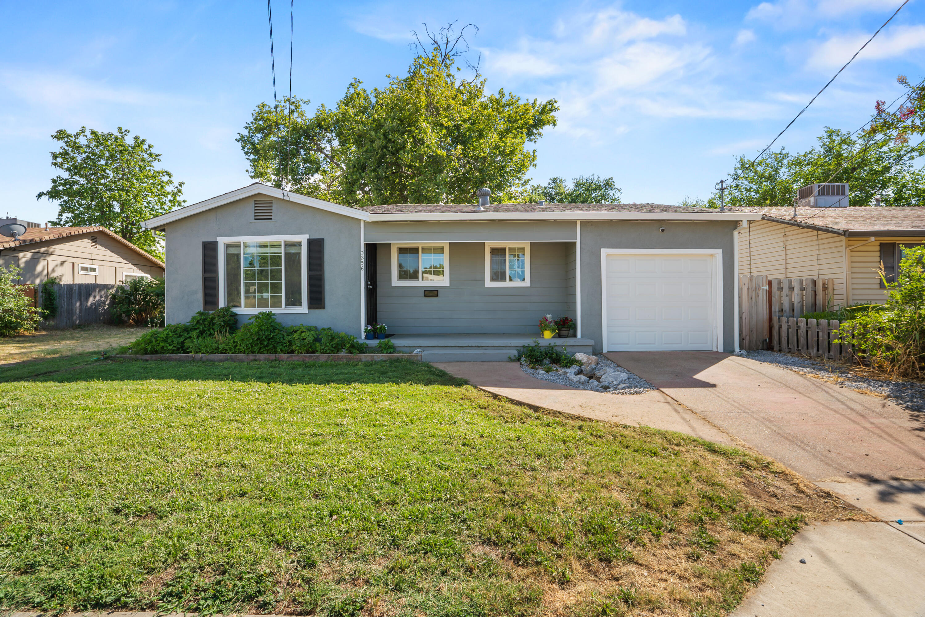 front view of a house with a yard