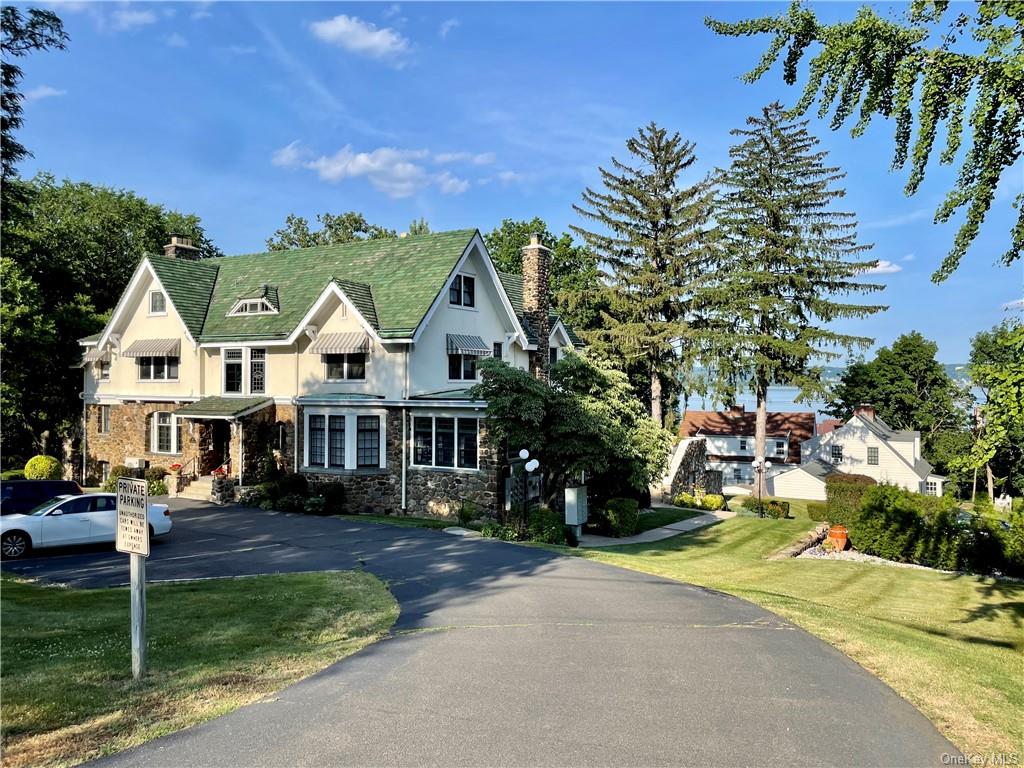 a view of multiple houses with a yard