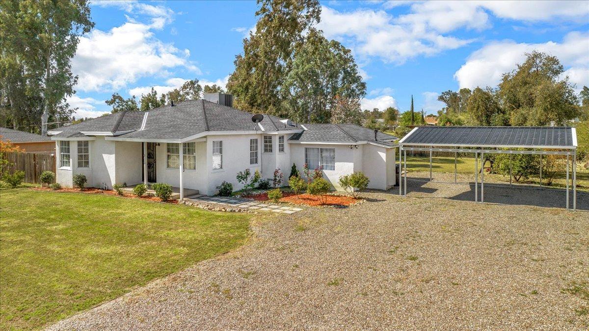 front view of a house with a yard