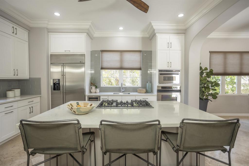 a kitchen with a table and chairs in it