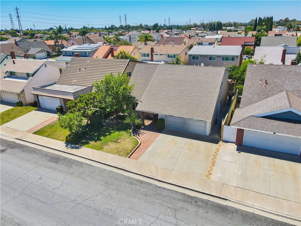 an aerial view of a house with a yard basket ball court and outdoor seating