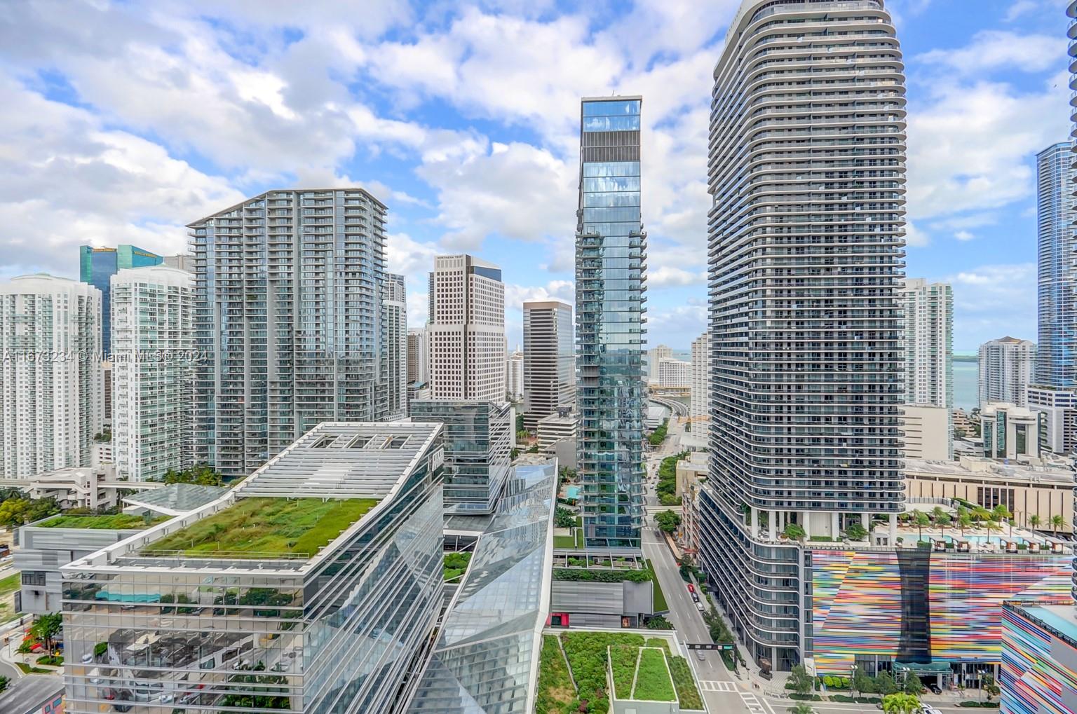 a view of city with tall buildings