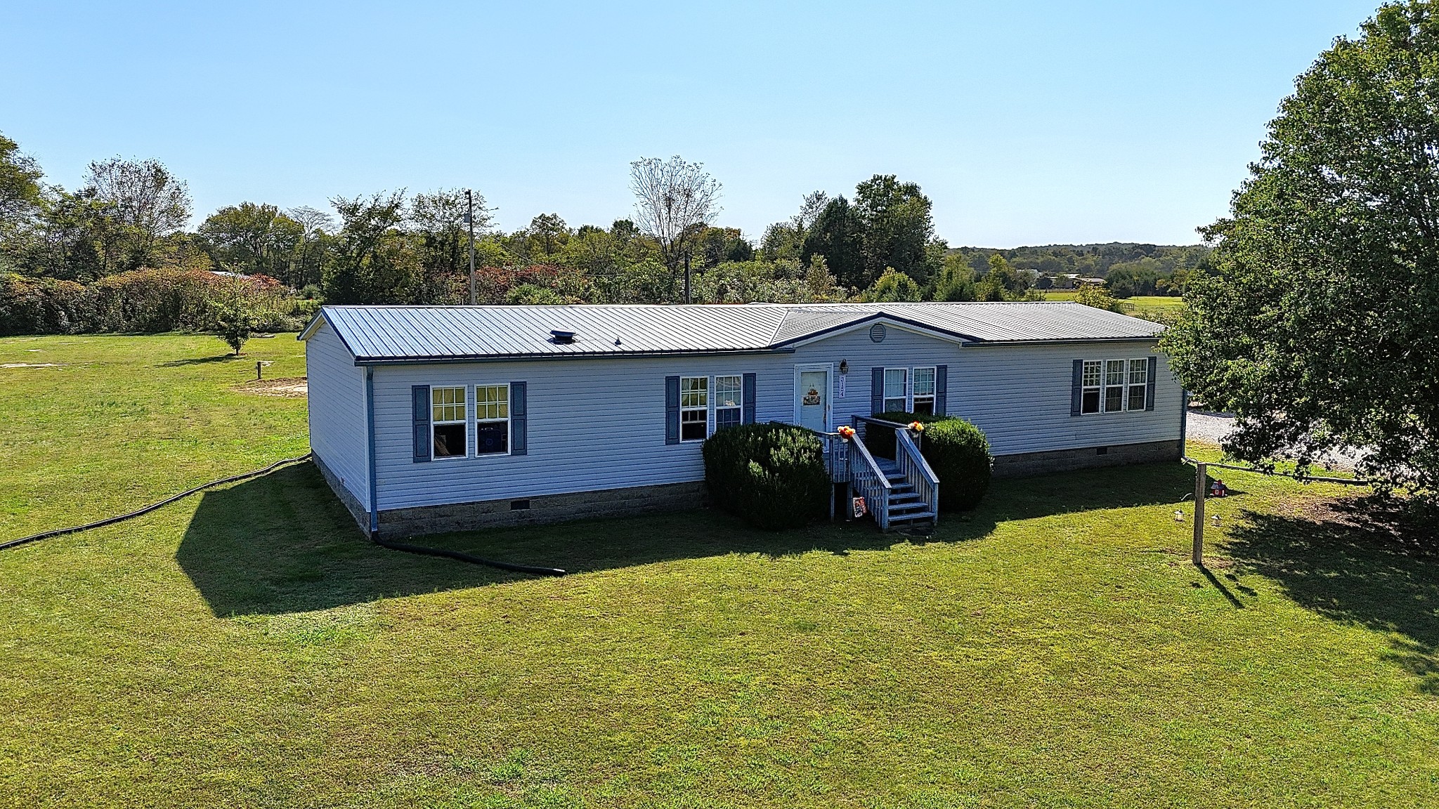 a view of a house with a big yard