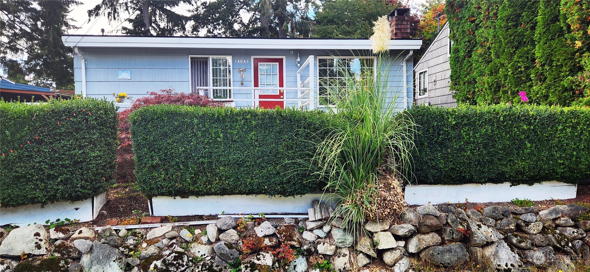 front view of a house with a yard