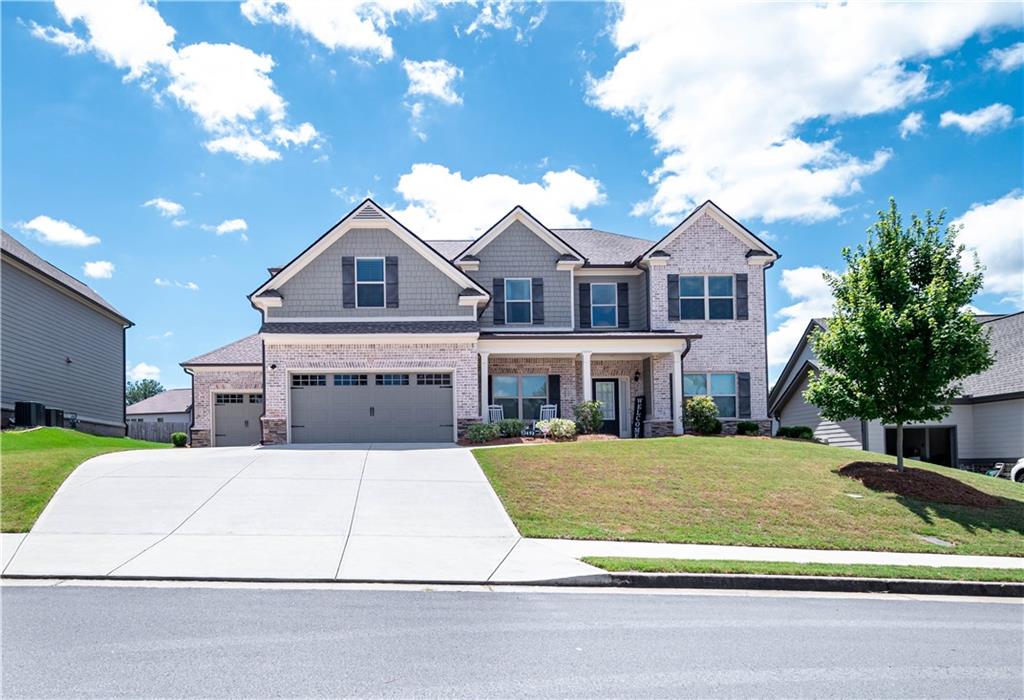 a front view of a house with a yard