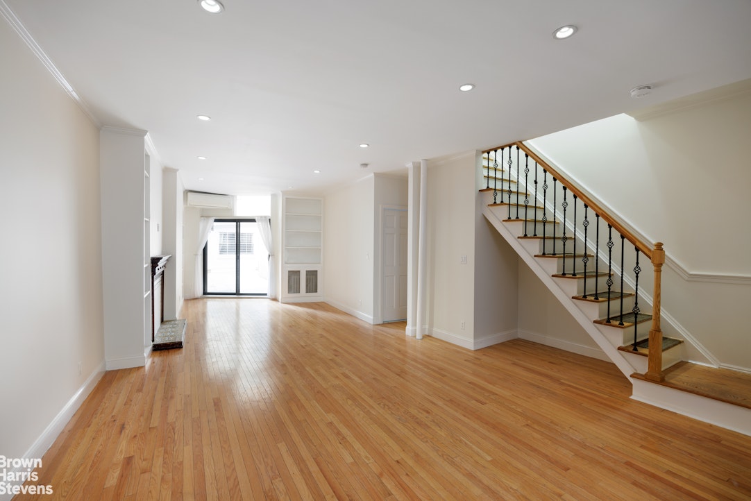 a view of entryway with wooden floor