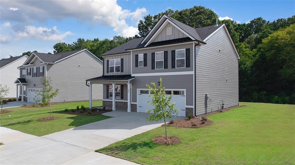 a front view of a house with a yard