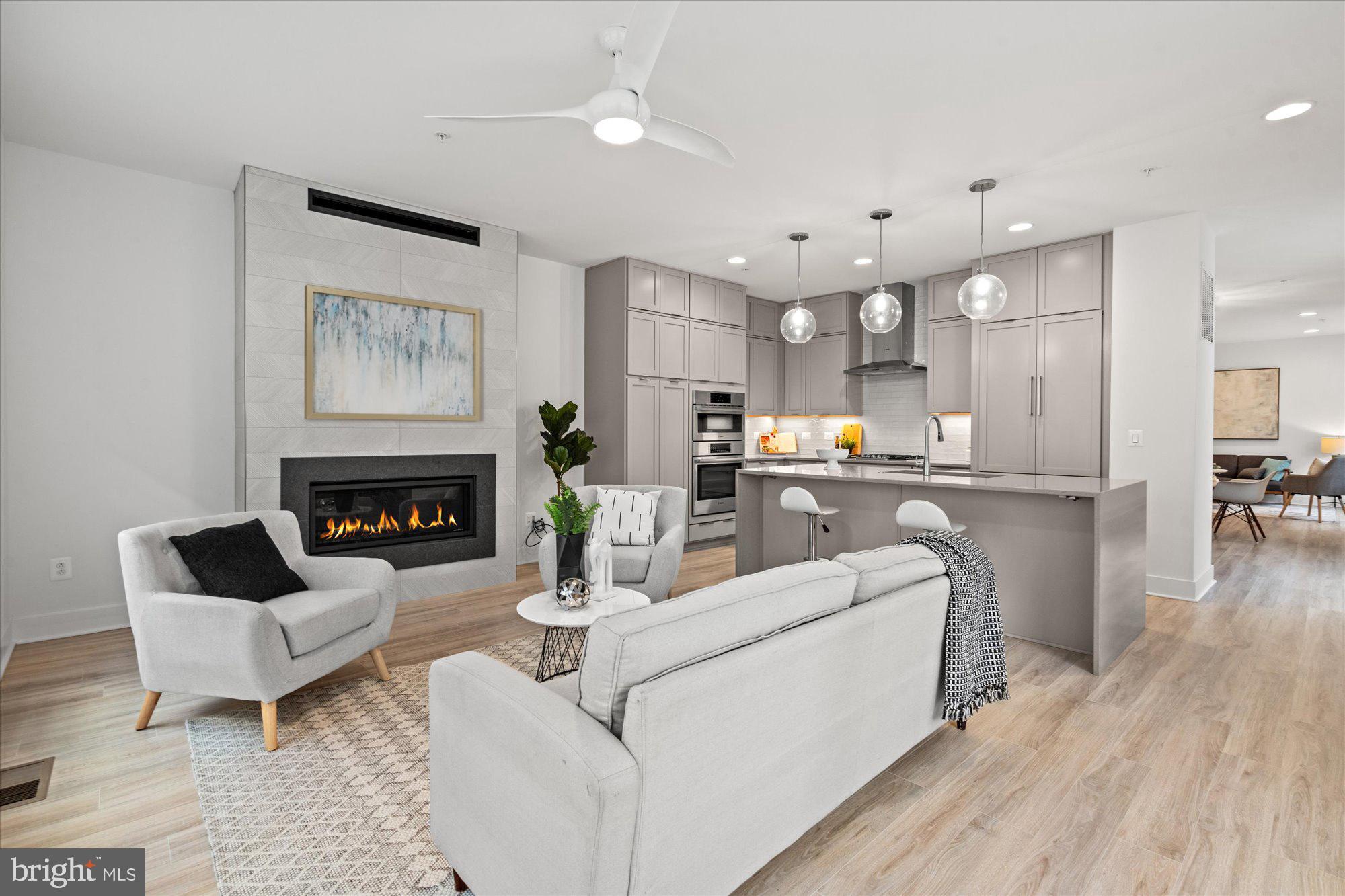 a living room with furniture and a fireplace