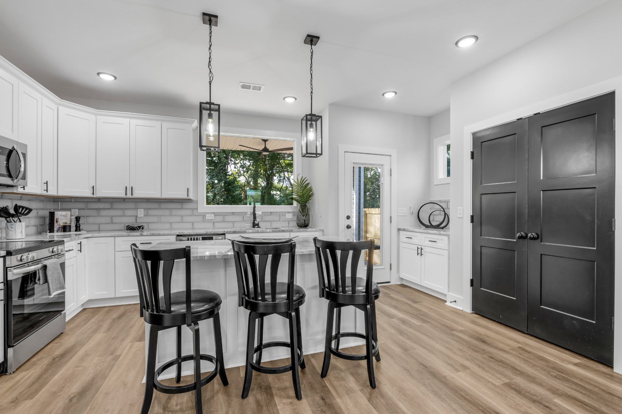 a kitchen with a table and chairs in it