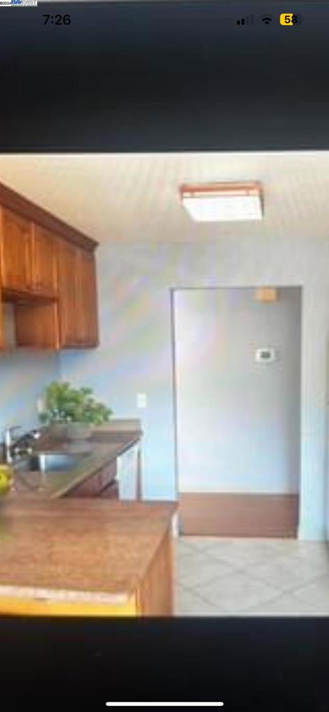 a view of kitchen with furniture and counter top