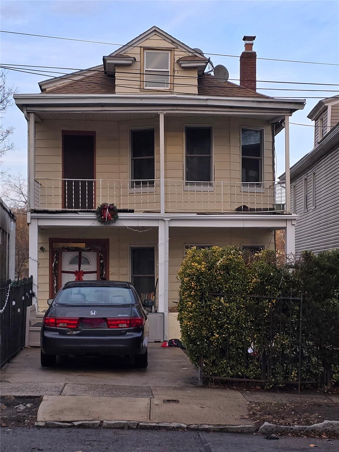 a view of a car parked in front of a house