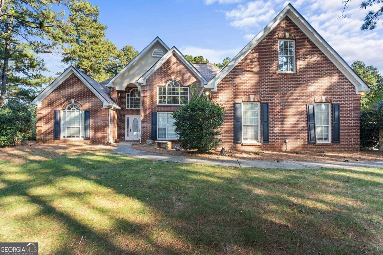 a front view of a house with a yard