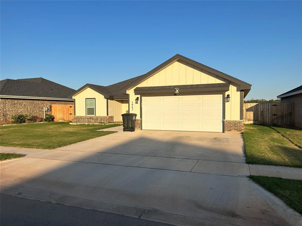 a view of garage and yard