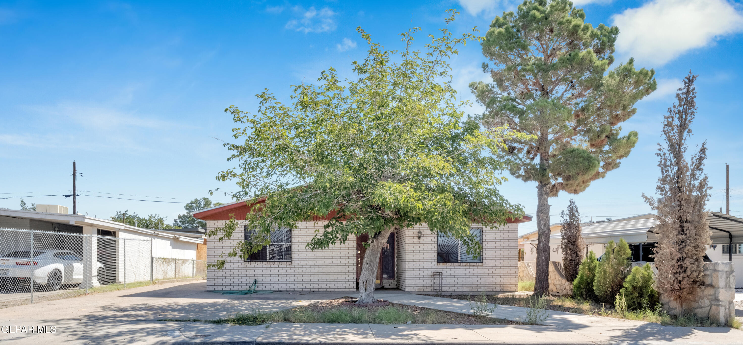 a view of a house with a tree