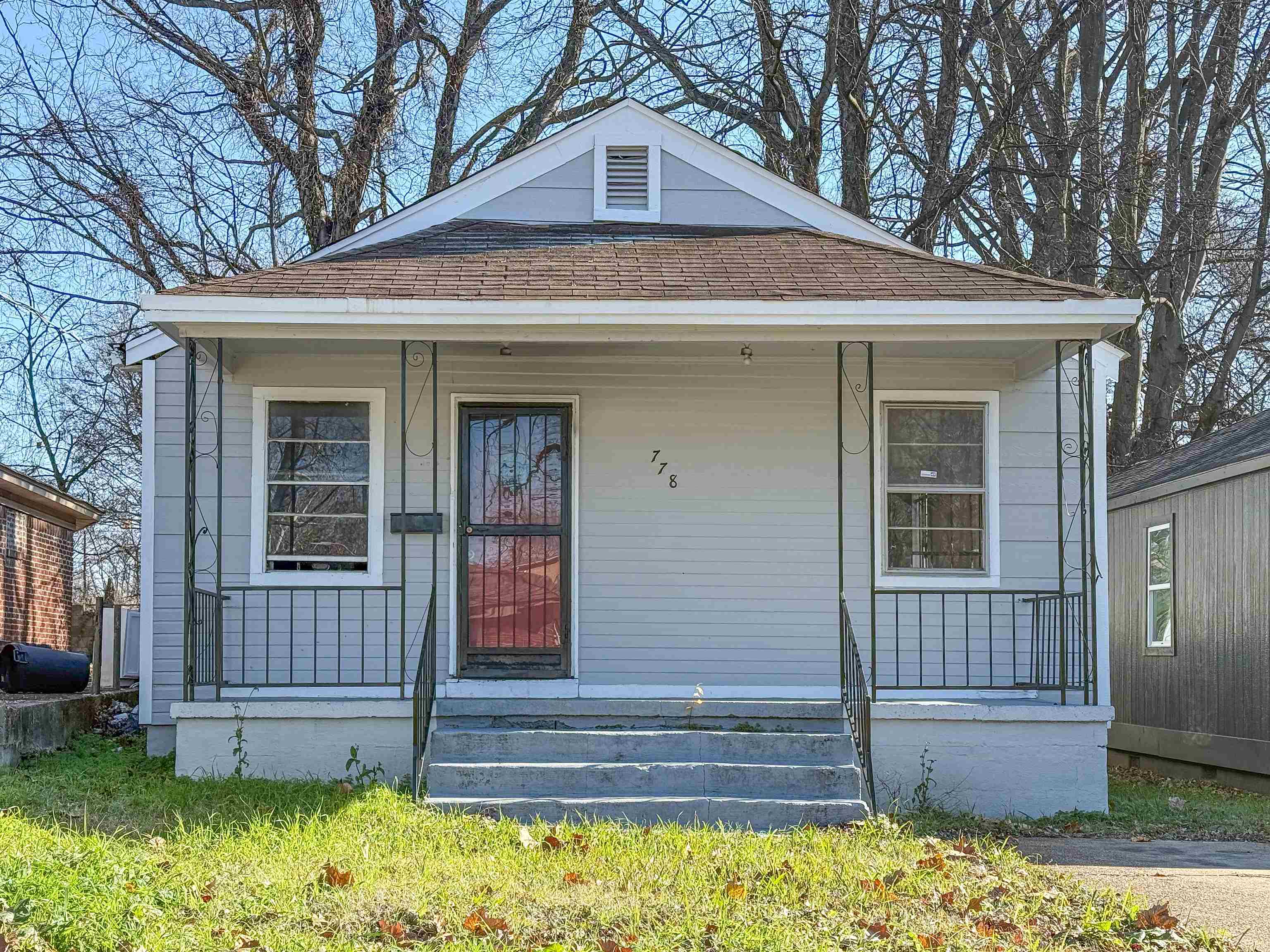 front view of a house with a yard