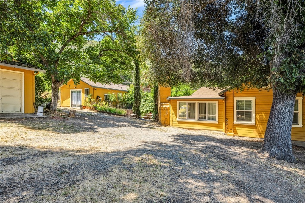 a house that has a tree in front of it