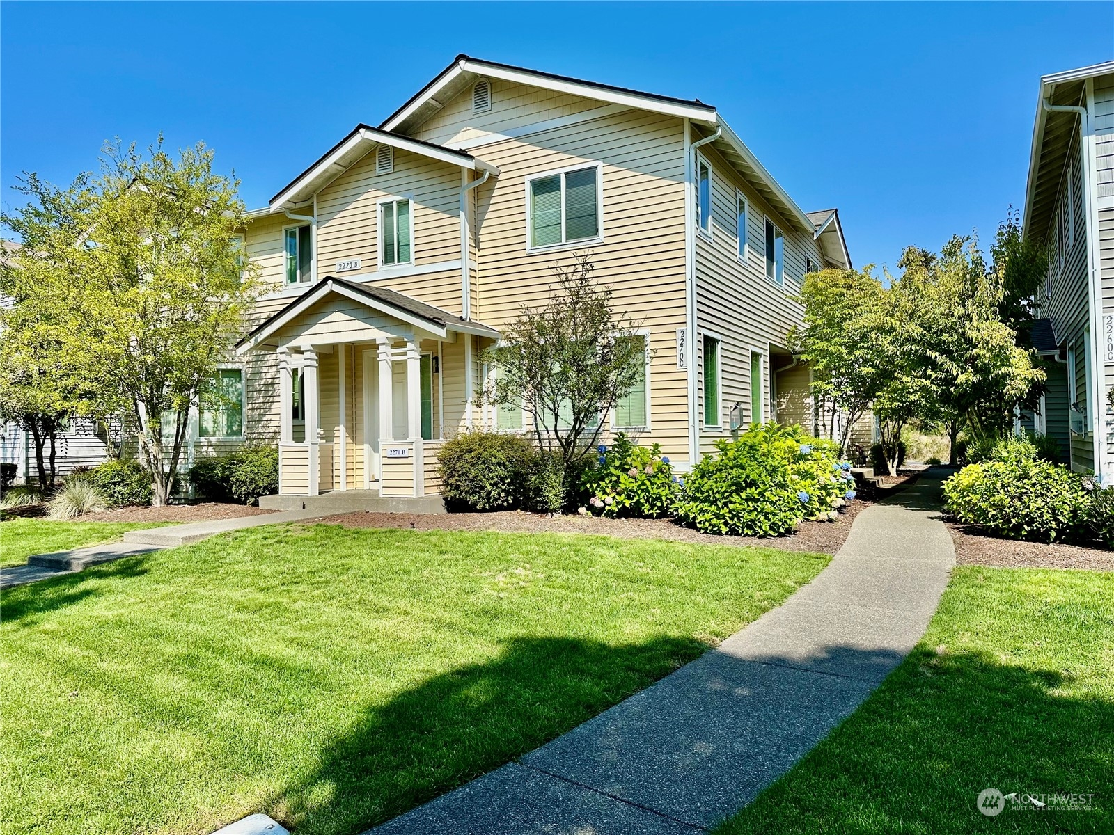 a front view of a house with a yard