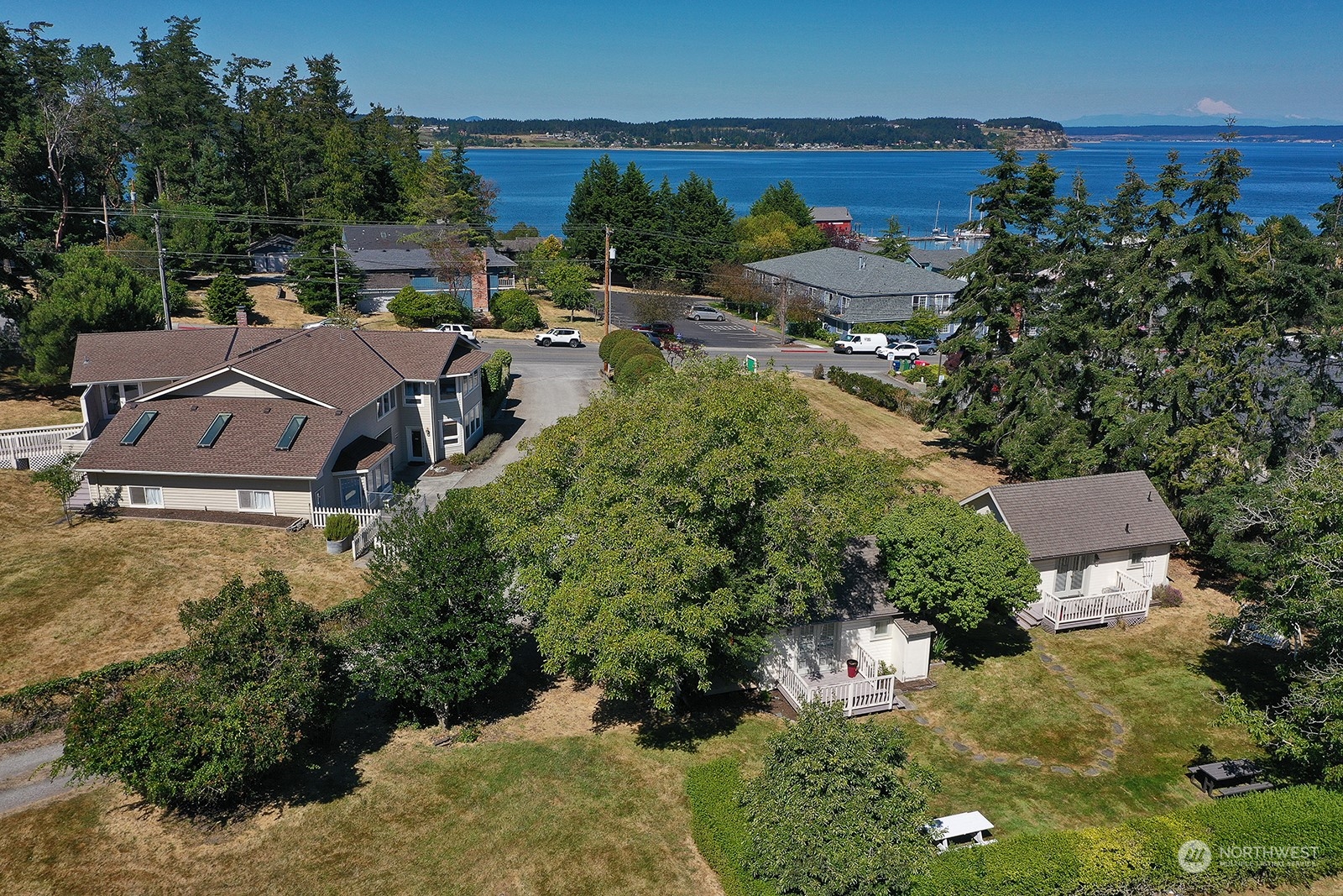 an aerial view of a house with outdoor space and street view