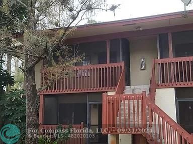 a view of a house with a deck