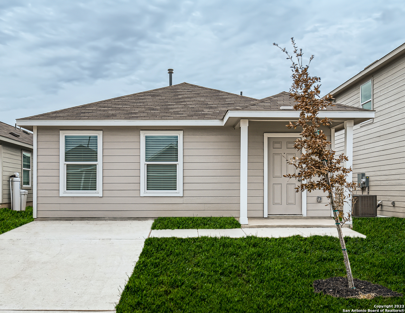 a front view of a house with a yard