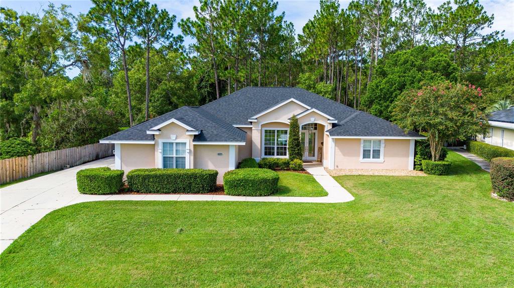 a front view of a house with a yard