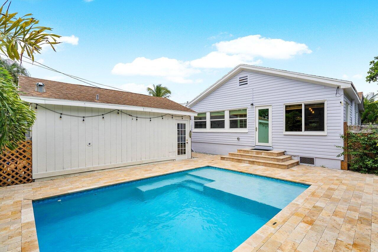 a front view of house with yard and outdoor seating